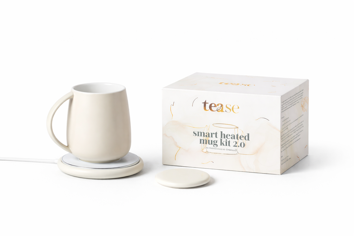 Smart heated mug kit with mug, coaster, and packaging on a white background